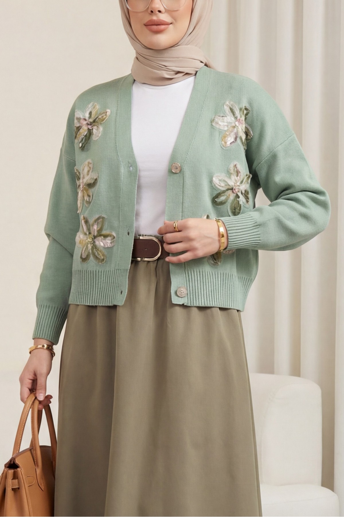 Buttoned knitted cardigan with sequin and floral details on the front. -Sea green