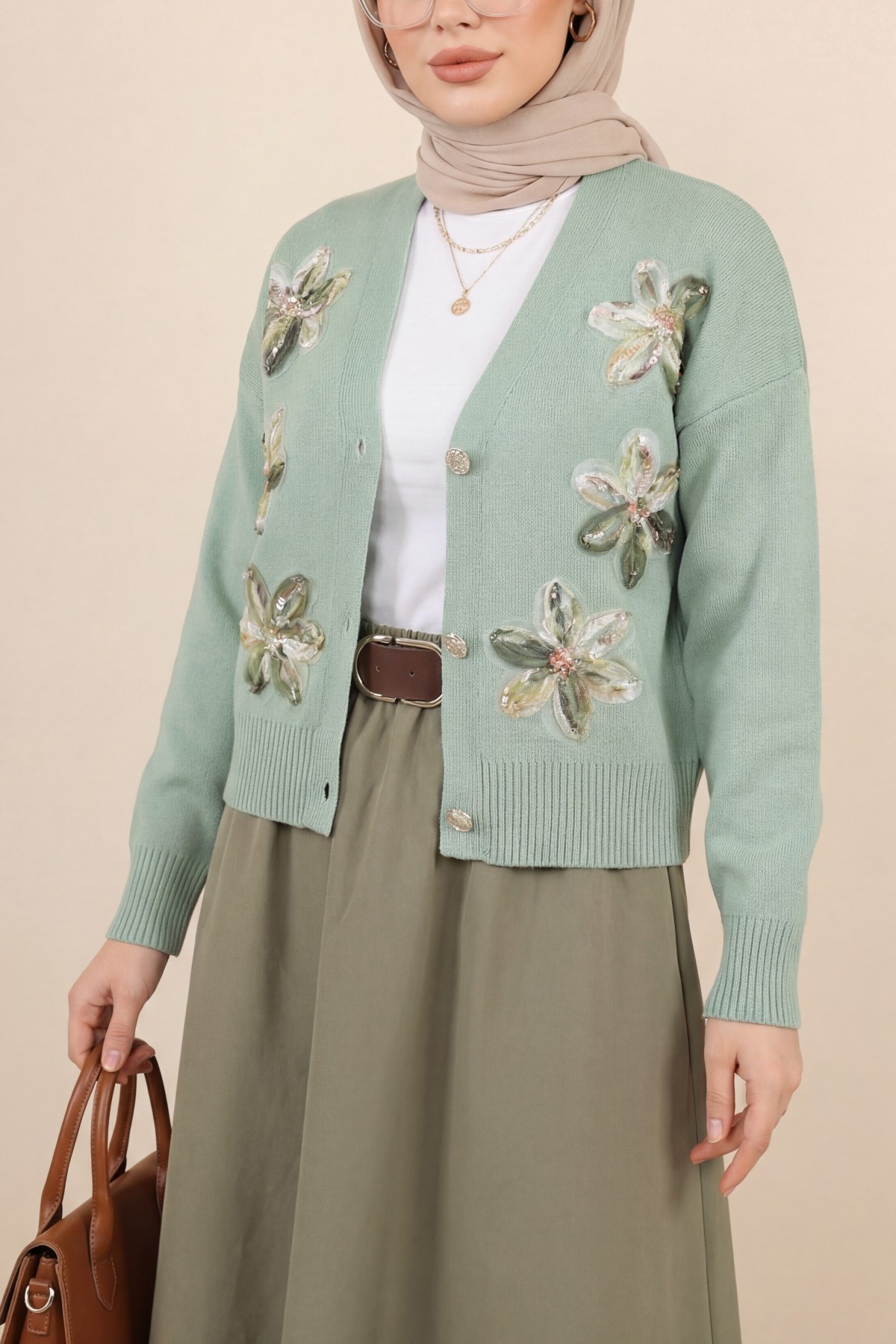 Buttoned knitted cardigan with sequin and floral details on the front. -Sea green