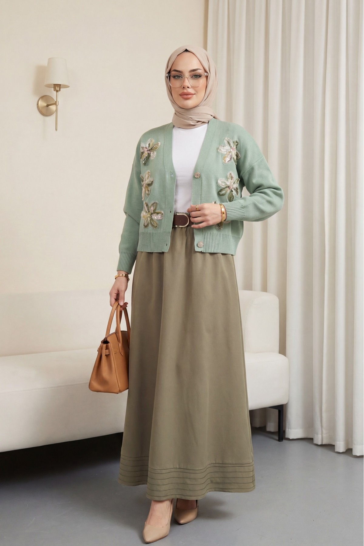 Buttoned knitted cardigan with sequin and floral details on the front. -Sea green