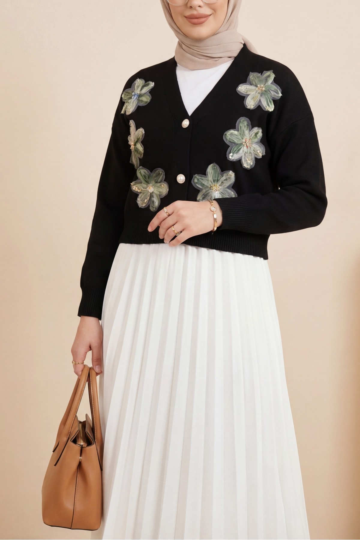 Buttoned knitted cardigan with sequin and floral details on the front.  -Black