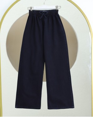 Bol Paça Beli Lastikli Bağcık Detaylı Kot Pantolon     -K.Laci